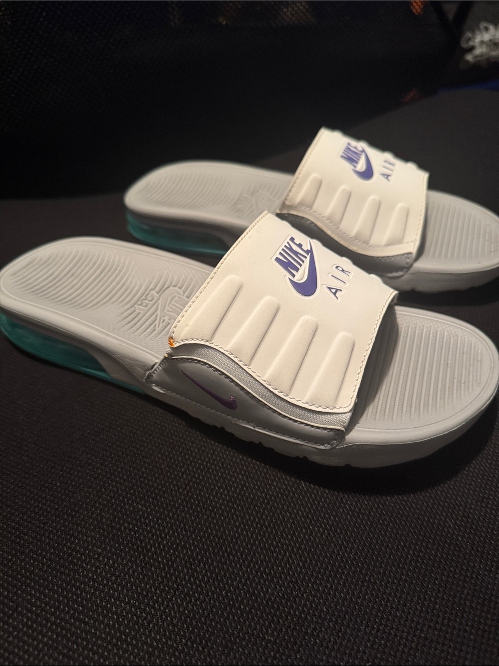 Women’s Nike Air Slide Sandals in White with Purple Accents